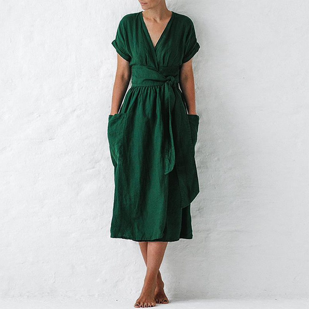 Green dress worn by a person on a white background