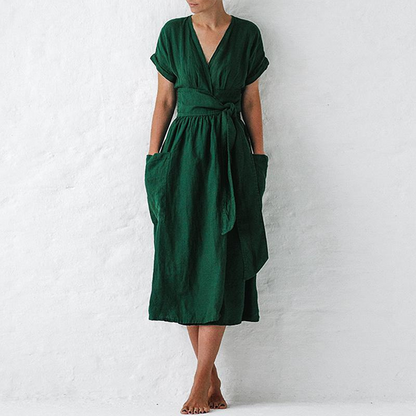 Green dress worn by a person on a white background