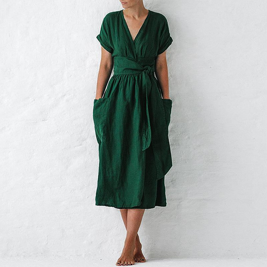 Green dress worn by a person on a white background