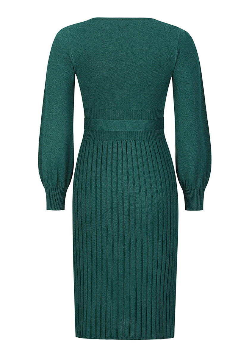 Green ribbed dress with long sleeves on a white background