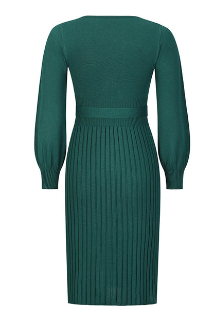 Green ribbed dress with long sleeves on a white background