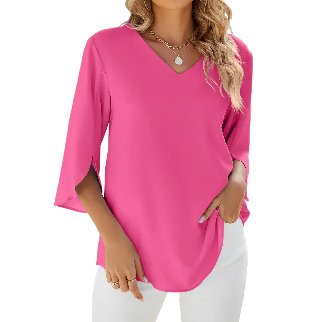 Woman wearing a bright pink blouse with a plain background