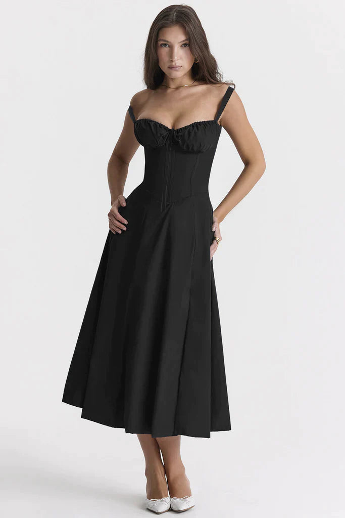 Woman wearing a black strapless dress on a white background