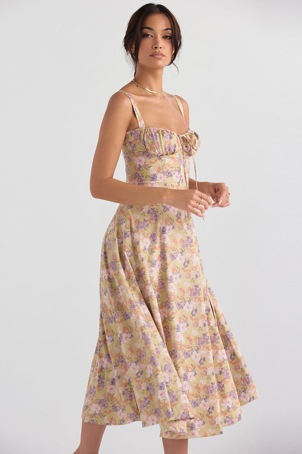 Woman wearing a floral dress on a white background