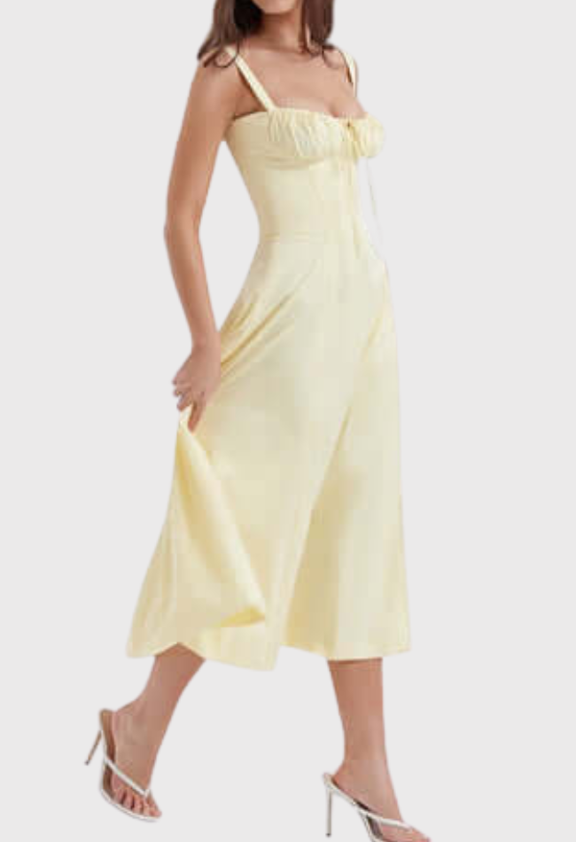 Woman wearing a yellow dress on a white background
