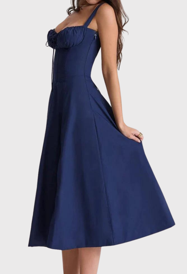 Navy blue dress with ruffled straps on a white background