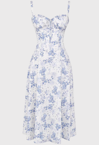 White strapless dress with blue floral pattern on a white background