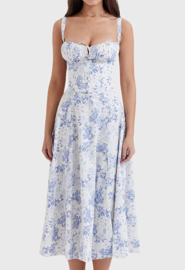 Woman wearing a floral dress with a white background