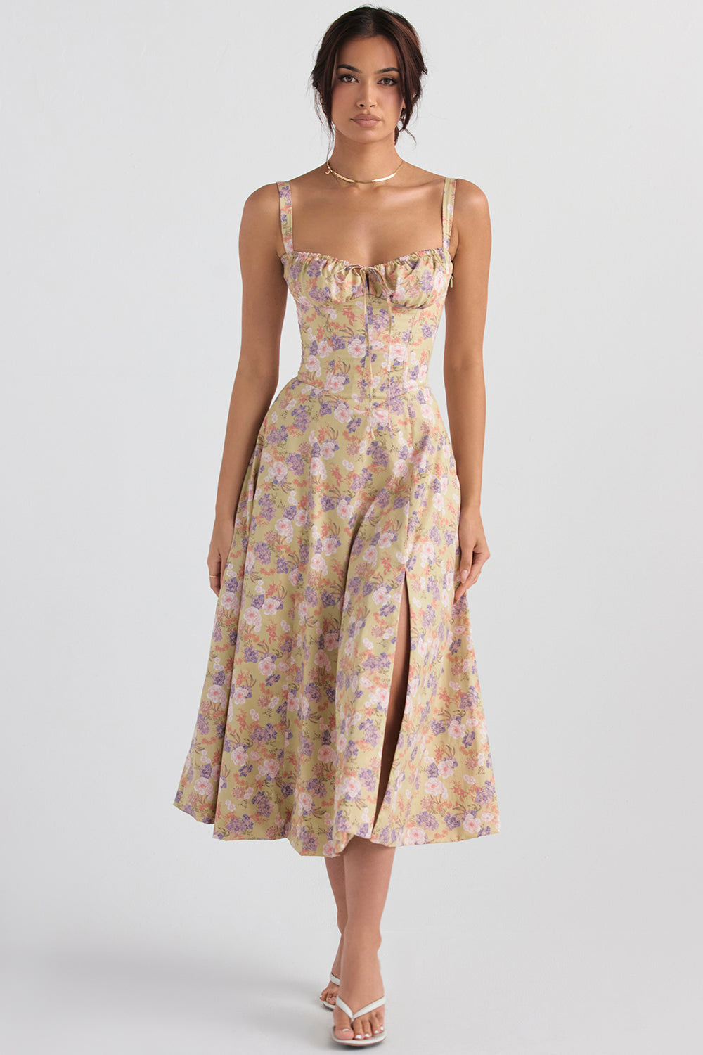 Woman wearing a floral dress on a white background