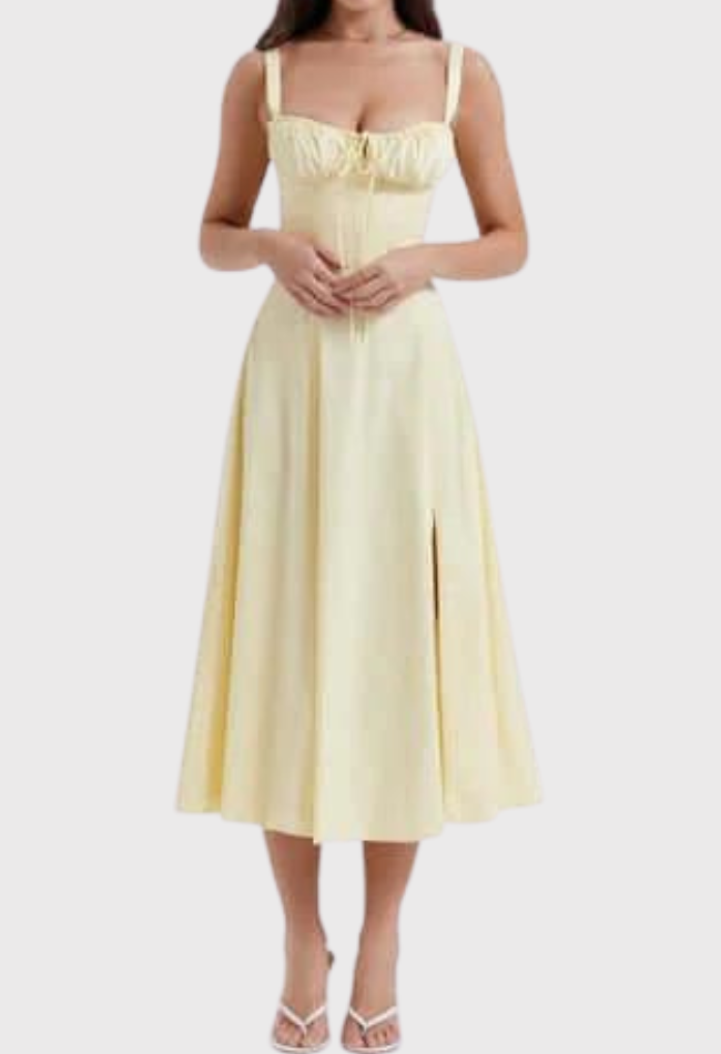 Woman wearing a light yellow dress on a white background