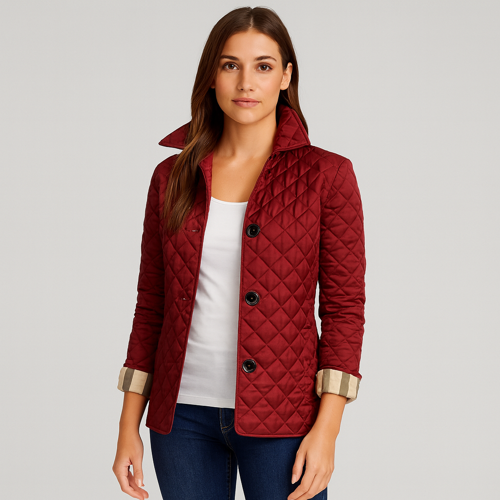 Woman wearing a red quilted jacket on a gray background