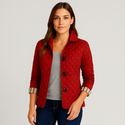 Woman wearing a red quilted jacket on a gray background